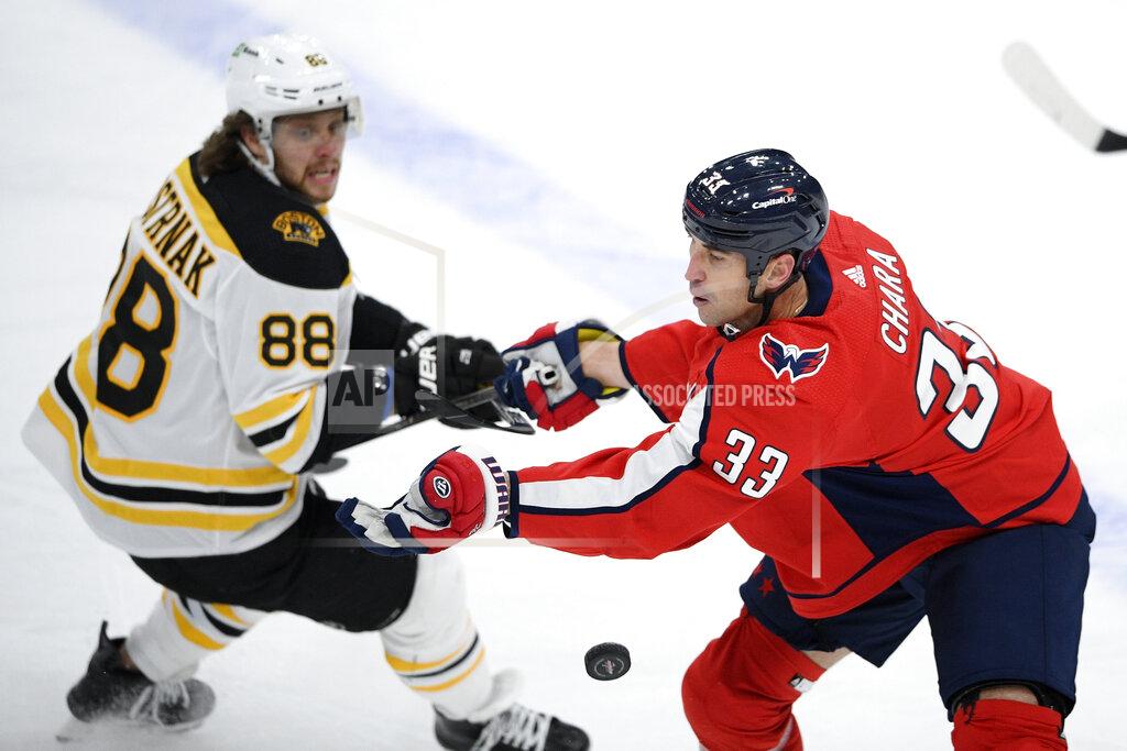 Nick Wass Washington Capitals defenseman Zdeno Chara (33) and Boston Bruins right wing David Pastrnak (88) battle for the puck during the first period of an NHL hockey game, Saturday, Jan. 30, 2021, in Washington. (AP Photo/Nick Wass)