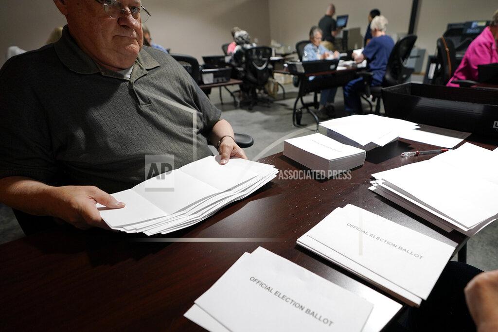 Keith Srakocic Election workers continue the process of counting ballots for the Pennsylvania primary election, Wednesday, May 18, 2022, at the Mercer County Elections Board in Mercer, Pa. Vote counting continues as Republican candidates Dr. Mehmet Oz and David McCormick are locked in a too-early-to-call race for Pennsylvania's hotly contested Republican nomination for an open U.S. Senate seat. (AP Photo/Keith Srakocic)