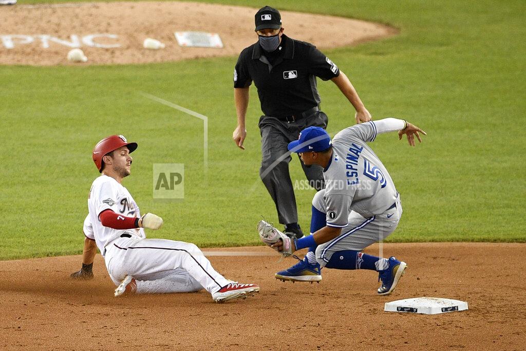 Nick Wass Washington Nationals' Trea Turner, left, is out as he tries to steal second base against Toronto Blue Jays shortstop Santiago Espinal (5) during the sixth inning of a baseball game, Tuesday, July 28, 2020, in Washington. The Blue Jays won 5-1. (AP Photo/Nick Wass)