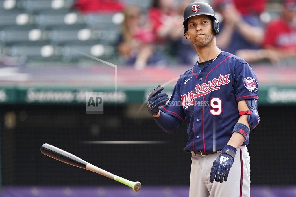 Tony Dejak Minnesota Twins' Andrelton Simmons throws his bat after striking out with the bases loaded in the sixth inning of a baseball game against the Cleveland Indians, Saturday, May 22, 2021, in Cleveland. (AP Photo/Tony Dejak)