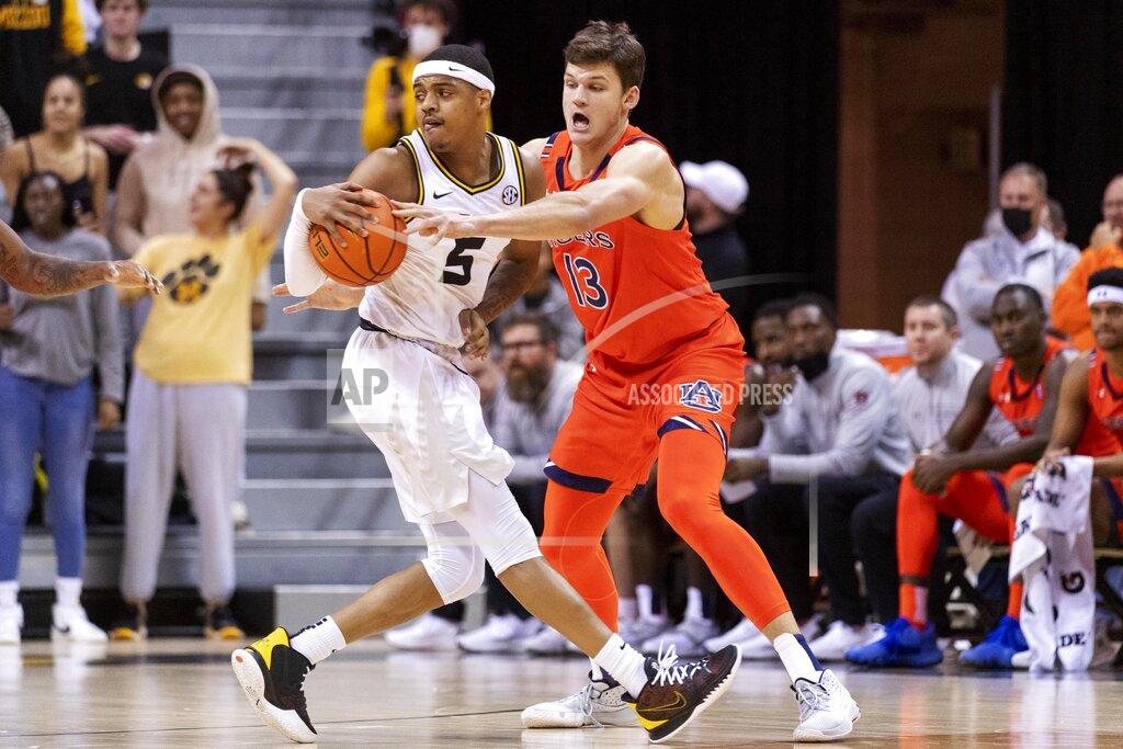 L.g. Patterson Auburn's Walker Kessler, right, tries to steal the ball from Missouri's Jarron Coleman, left, during the first half of an NCAA college basketball game Tuesday, Jan. 25, 2022, in Columbia, Mo. (AP Photo/L.G. Patterson)