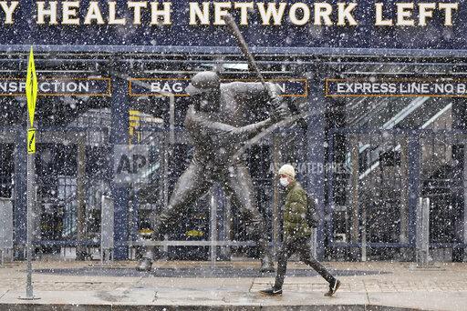 Gene J. Puskar Snow falls on a statue of Pittsburgh Pirates baseball Hall of Famer Willie Stargell, outside PNC Park on Pittsburgh's Northside, Thursday, April 1, 2021. The Pirates open the season in Chicago today against the Chicago Cubs. The Pirates' home opener is April 8, against the Chicago Cubs. (AP Photo/Gene J. Puskar)