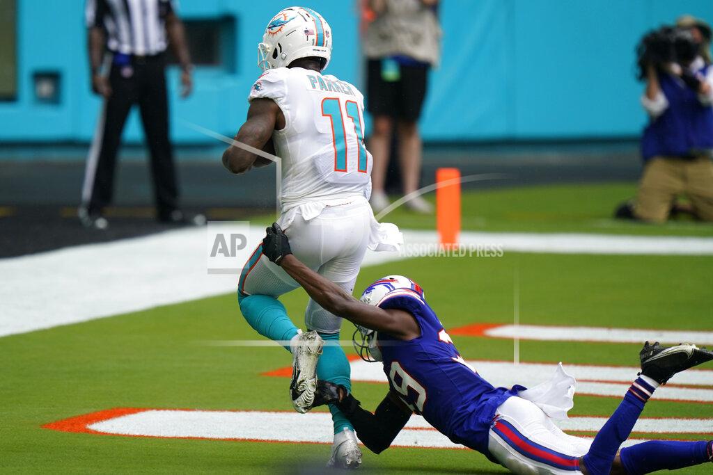 Wilfredo Lee Miami Dolphins wide receiver DeVante Parker (11) scores a touchdown as Buffalo Bills cornerback Levi Wallace (39) attempts to tackle, during the first half of an NFL football game, Sunday, Sept. 20, 2020 in Miami Gardens, Fla. (AP Photo/Wilfredo Lee)
