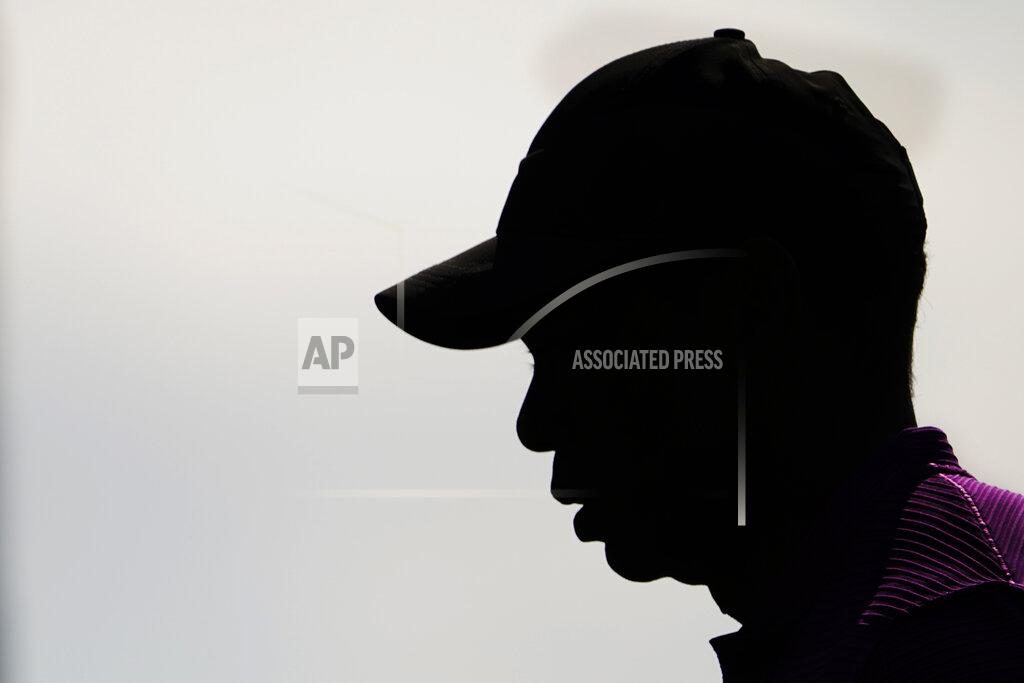 David J. Phillip Tiger Woods walks alone the fourth fairway during the third round of the Masters golf tournament Saturday, Nov. 14, 2020, in Augusta, Ga. (AP Photo/David J. Phillip)