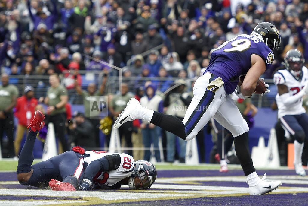 Gail Burton Baltimore Ravens tight end Mark Andrews (89) catches a touchdown pass from quarterback Lamar Jackson, not visible, as Houston Texans strong safety Justin Reid (20) falls while trying to make a diving stop in the end zone during the first half of an NFL football game, Sunday, Nov. 17, 2019, in Baltimore. (AP Photo/Gail Burton)