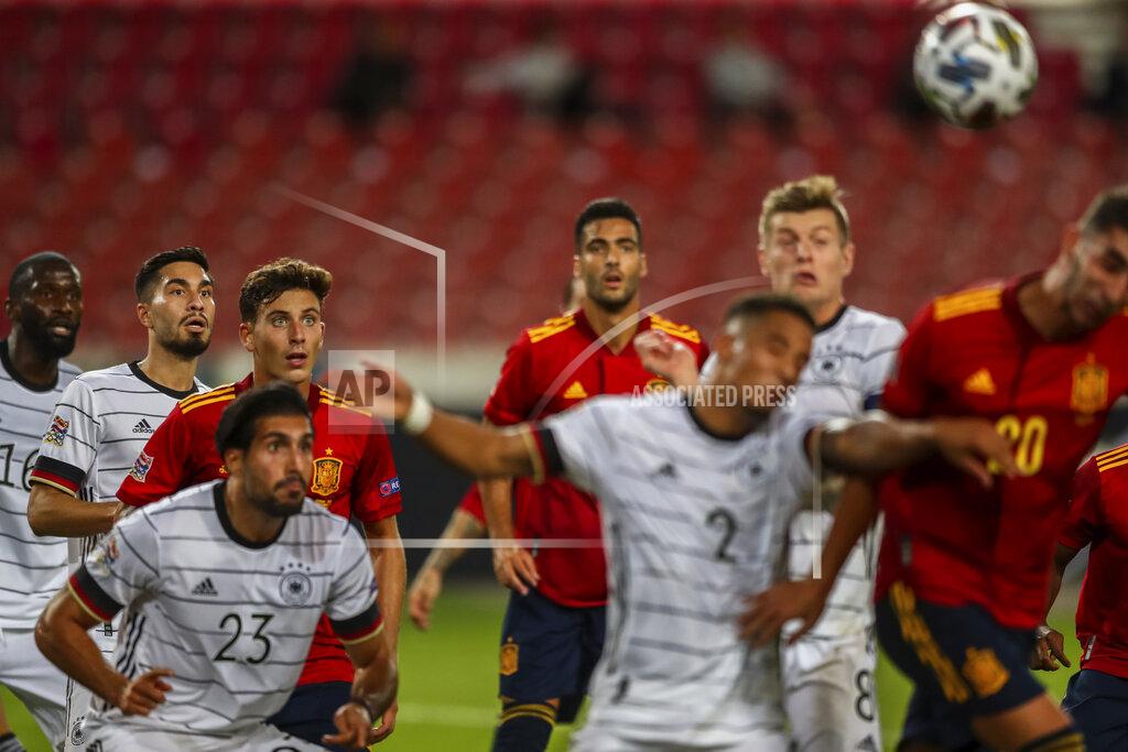 Matthias Schrader Germany and Spain players view for the ball during the UEFA Nations League soccer match at the Mercedes-Benz Arena stadium in Stuttgart, Germany, Thursday, Sept. 3, 2020. (AP Photo/Matthias Schrader)