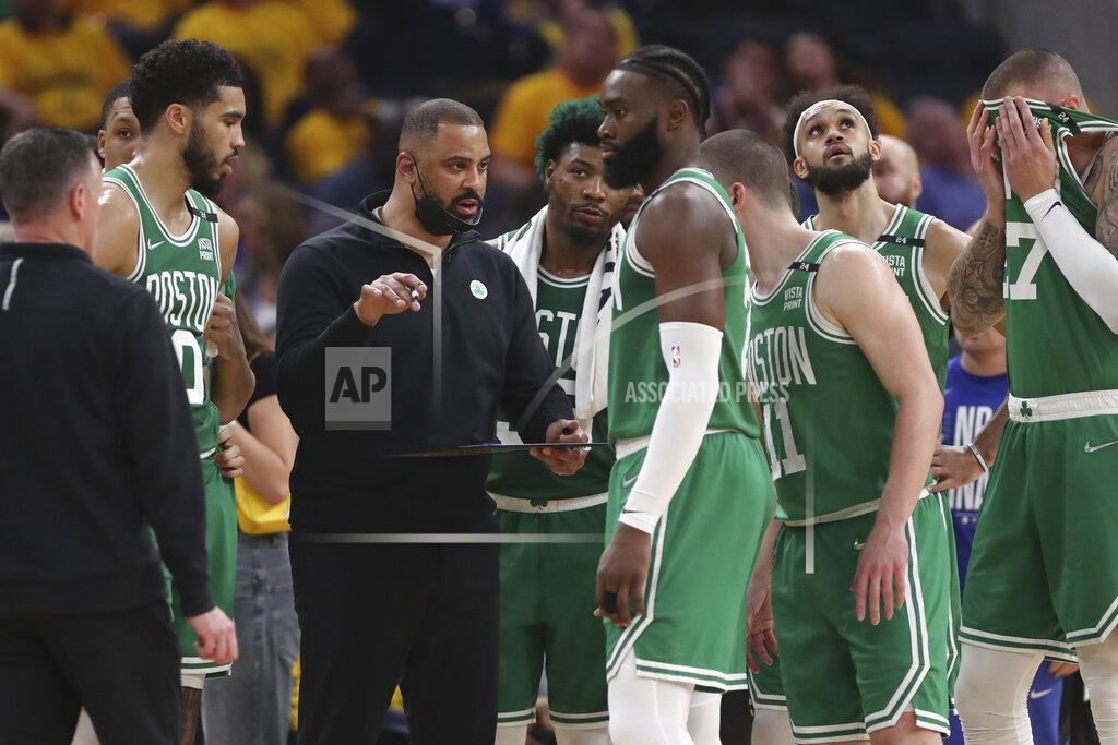 Jed Jacobsohn FILE - Boston Celtics head coach Ime Udoka, center left, talks with players during the first half of Game 2 of basketball's NBA Finals against the Golden State Warriors in San Francisco, Sunday, June 5, 2022. The Boston Celtics are planning to discipline coach Ime Udoka, likely with a suspension, because of an improper relationship with a member of the organization, two people with knowledge of the matter told The Associated Press on Thursday, Sept. 22, 2022. (AP Photo/Jed Jacobsohn, File)