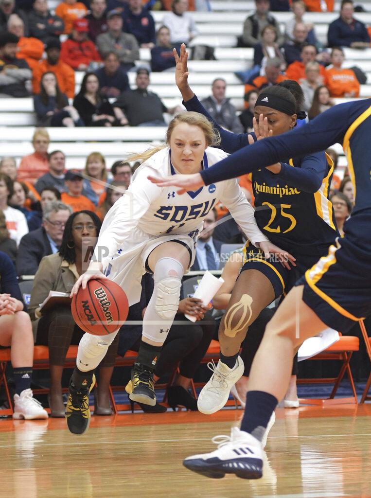 Heather Ainsworth South Dakota State's Madison Guebert (11) drives past Quinnipiac's Aryn McClure (25) during a first round of women's college basketball game in the NCAA Tournament in Syracuse, N.Y., Saturday, March 23, 2019. (AP Photo/Heather Ainsworth)