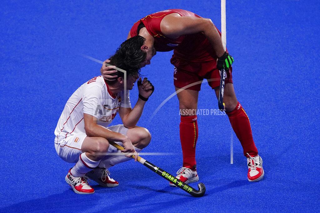 John Locher Belgium's Arthur Van Doren, comforts Spain's Josep Romeu Argemi after Belgium won their men's field hockey match at the 2020 Summer Olympics, Sunday, Aug. 1, 2021, in Tokyo, Japan. (AP Photo/John Locher)