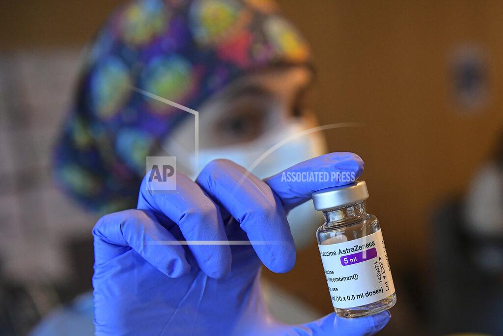 Alvaro Barrientos A health worker holds a dose of the AstraZeneca COVID-19 vaccine, during a mass vaccination campaign at San Pedro Hospital, in Logrono, northern Spain, Wednesday, March 24, 2021. Spain resumed the use of the AstraZeneca vaccine on Wednesday. (AP Photo/Alvaro Barrientos)