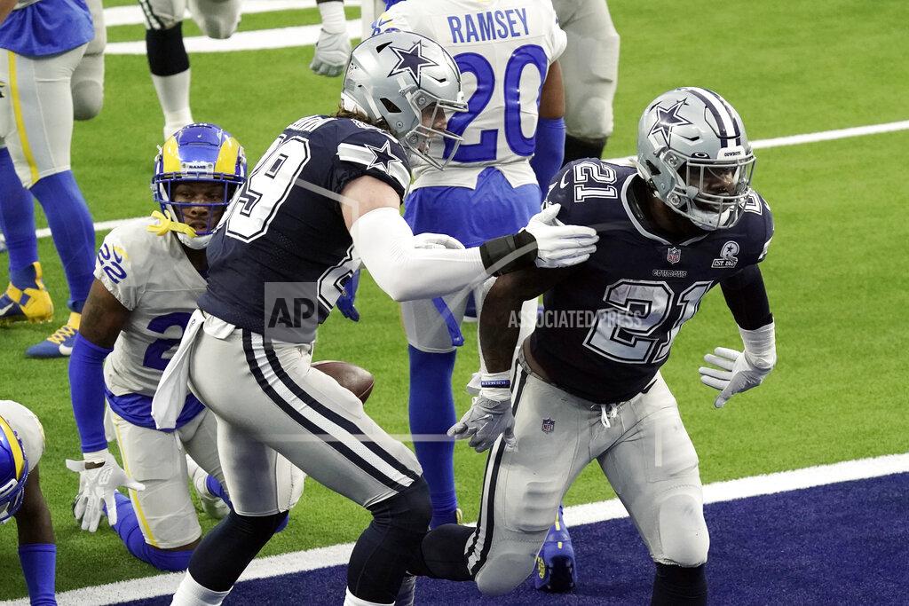 Jae C. Hong Dallas Cowboys running back Ezekiel Elliott (21) celebrates after scoring a touchdown against the Los Angeles Rams during the first half of an NFL football game Sunday, Sept. 13, 2020, in Inglewood, Calif. (AP Photo/Jae C. Hong )