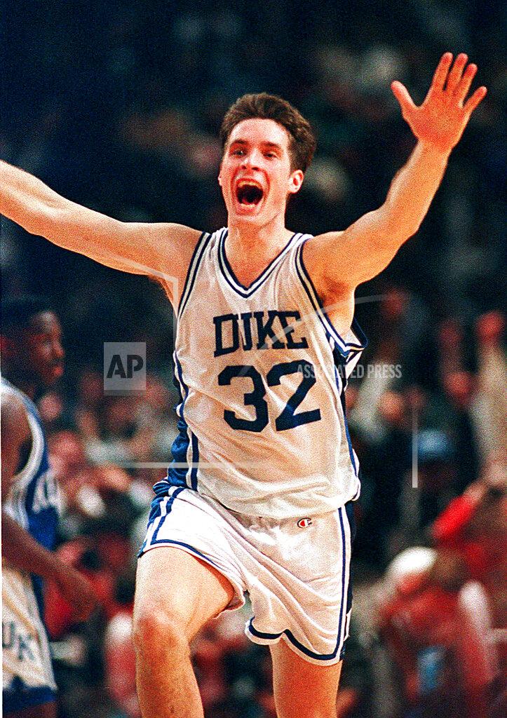 Amy Sancetta FILE - In this March 28, 1992, file photo, Duke's Christian Laettner runs down the court after making the last-second winning shot to defeat Kentucky in the East Regional final NCAA college basketball game in Philadelphia. The All-American ended one of the greatest college basketball games ever with a turnaround jumper at the overtime buzzer, giving defending national champion Duke a 104-103 victory over Kentucky and a fifth straight trip to the Final Four. (AP Photo/Amy Sancetta, File)