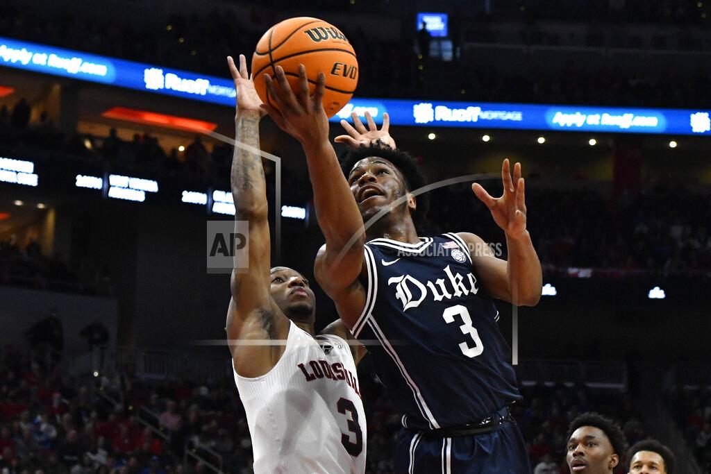 Timothy D. Easley Duke guard Jeremy Roach (3) shoots past Louisville guard El Ellis (3) during the first half of an NCAA college basketball game in Louisville, Ky., Saturday, Jan. 29, 2022. (AP Photo/Timothy D. Easley)
