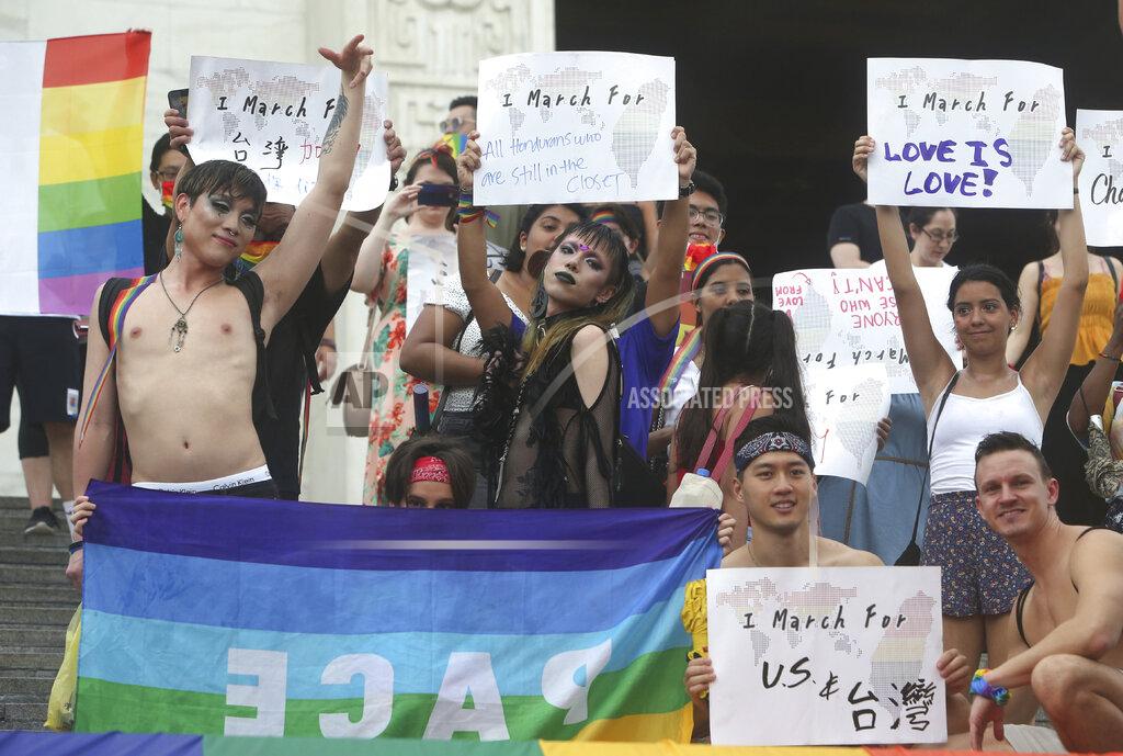 Chiang Ying-Ying Participants march during the "Taiwan Pride March for the World!" at Liberty Square at the CKS Memorial Hall in Taipei, Taiwan, Sunday, June 28, 2020. This year marks the first Gay Pride march in Chicago 1970, and due to the COVID-19 lockdown, Taiwan is one of the very few countries to host the world's only physical Gay Pride. (AP Photo/Chiang Ying-ying)