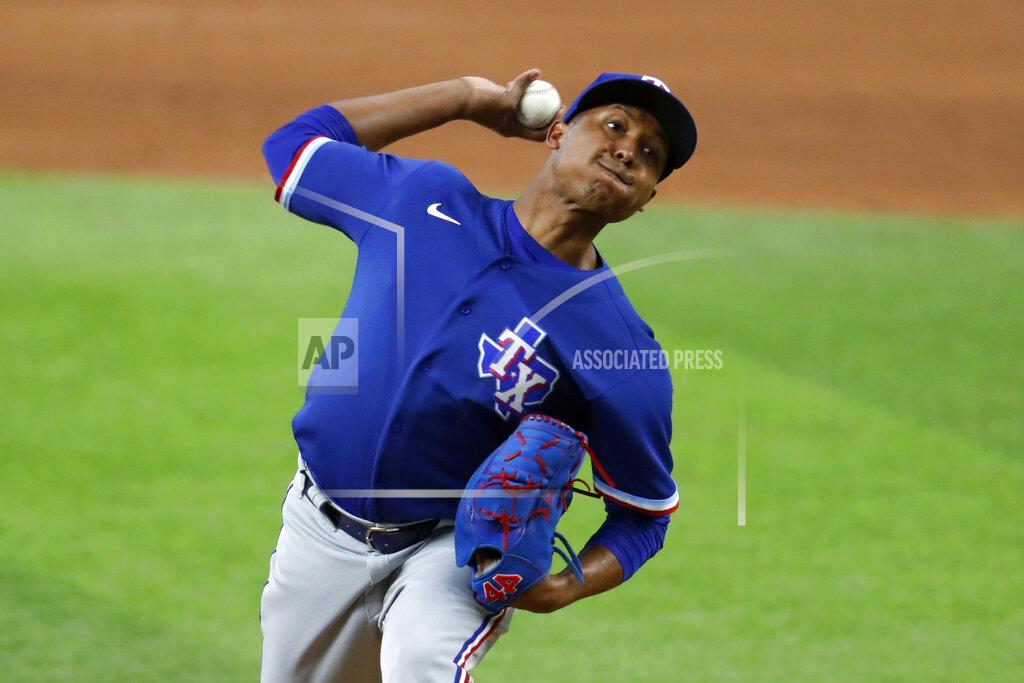 Tony Gutierrez Texas Rangers pitcher Jose Leclerc throws to the plate during an intrasquad practice baseball game at Globe Life Field in Arlington, Texas, Monday, July 6, 2020. (AP Photo/Tony Gutierrez)
