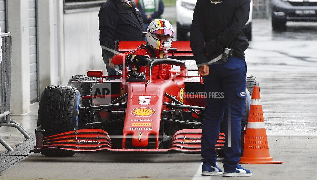 Joe Klamar Ferrari driver Sebastian Vettel of Germany leaves his car at the end of the qualifying session for the Styrian Formula One Grand Prix at the Red Bull Ring racetrack in Spielberg, Austria, Saturday, July 11, 2020. The Styrian F1 Grand Prix will be held on Sunday. (Joe Klamar/Pool via AP)