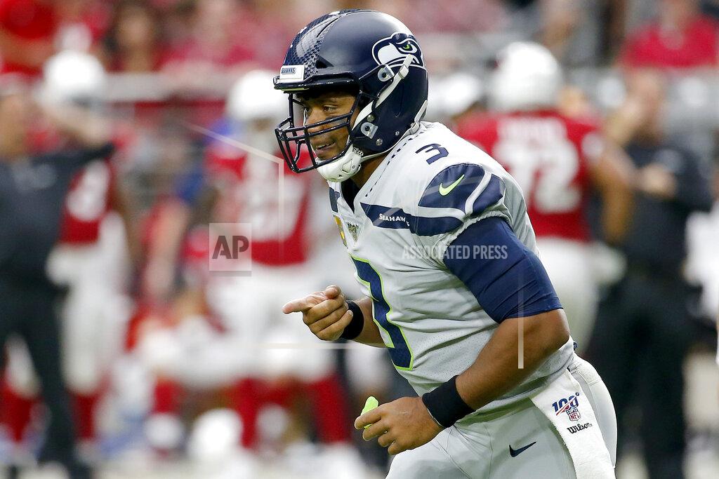 Rick Scuteri Seattle Seahawks quarterback Russell Wilson (3) celebrates a touchdown against the Arizona Cardinals during the first half of an NFL football game, Sunday, Sept. 29, 2019, in Glendale, Ariz. (AP Photo/Rick Scuteri)