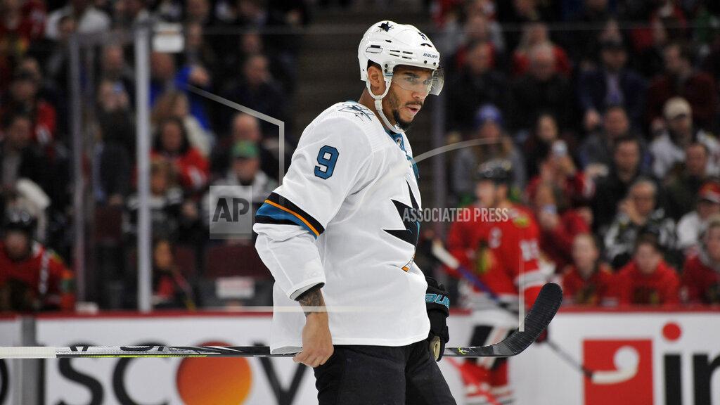 Paul Beaty FILE - In this March 11, 2020 file photo, San Jose Sharks' Evander Kane (9) looks on during the first period of an NHL hockey game against the Chicago Blackhawks in Chicago. The predominantly white sport of hockey has a checkered history of racism and a culture of not standing out from the team or speaking out. The death of George Floyd in Minnesota has shattered that silence. (AP Photo/Paul Beaty, File)
