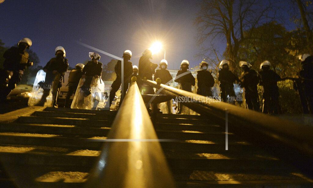Czarek Sokolowski Police stand guard while protesters block the parliament in Warsaw, Poland, Wednesday Oct. 28, 2020. People across Poland stayed off their jobs and huge crowds poured onto the streets for a seventh straight day of protests Wednesday, enraged over a top court ruling that bans abortions in cases of fetal abnormalities. (AP Photo/Czarek Sokolowski)