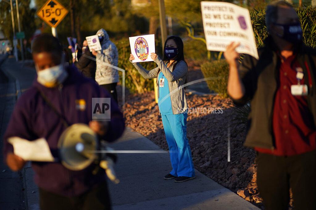 John Locher Healthcare workers protest coronavirus pandemic working conditions at Sunrise hospital Wednesday, Dec. 2, 2020, in Las Vegas. (AP Photo/John Locher)