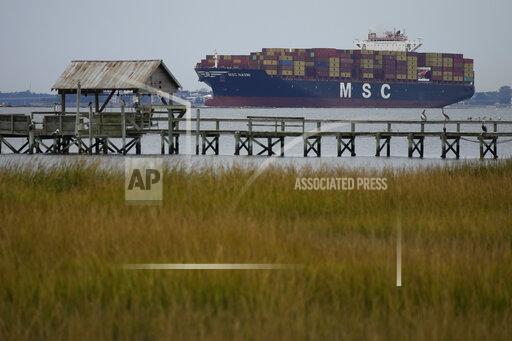 The MSC Naomi container ship sails out from from the port of Charleston, S.C.,Thursday, Oct. 28, 2021. Hampered by rising COVID-19 cases and persistent supply shortages, the U.S. economy slowed sharply to a 2% annual growth rate in the July-September period, the weakest quarterly expansion since the recovery from the pandemic recession began last year. (AP Photo/Rebecca Blackwell)