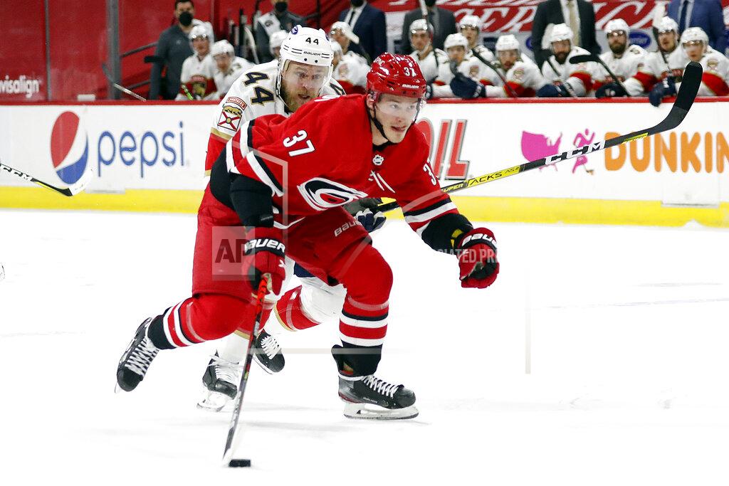 Karl B Deblaker Carolina Hurricanes' Andrei Svechnikov (37) brings the puck up the ice after taking it away from Florida Panthers' Kevin Connauton (44) during the second period of an NHL hockey game in Raleigh, N.C., Sunday, March 7, 2021. (AP Photo/Karl B DeBlaker)