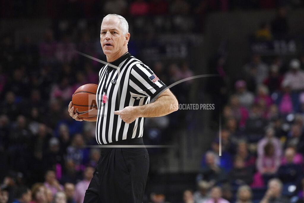 Jessica Hill Referee Bruce Morris officiates an NCAA college basketball game between Connecticut and Temple, Saturday, Feb. 9, 2019, in Storrs, Conn. Morris holds an NCAA record for the longest shot recorded.(AP Photo/Jessica Hill)