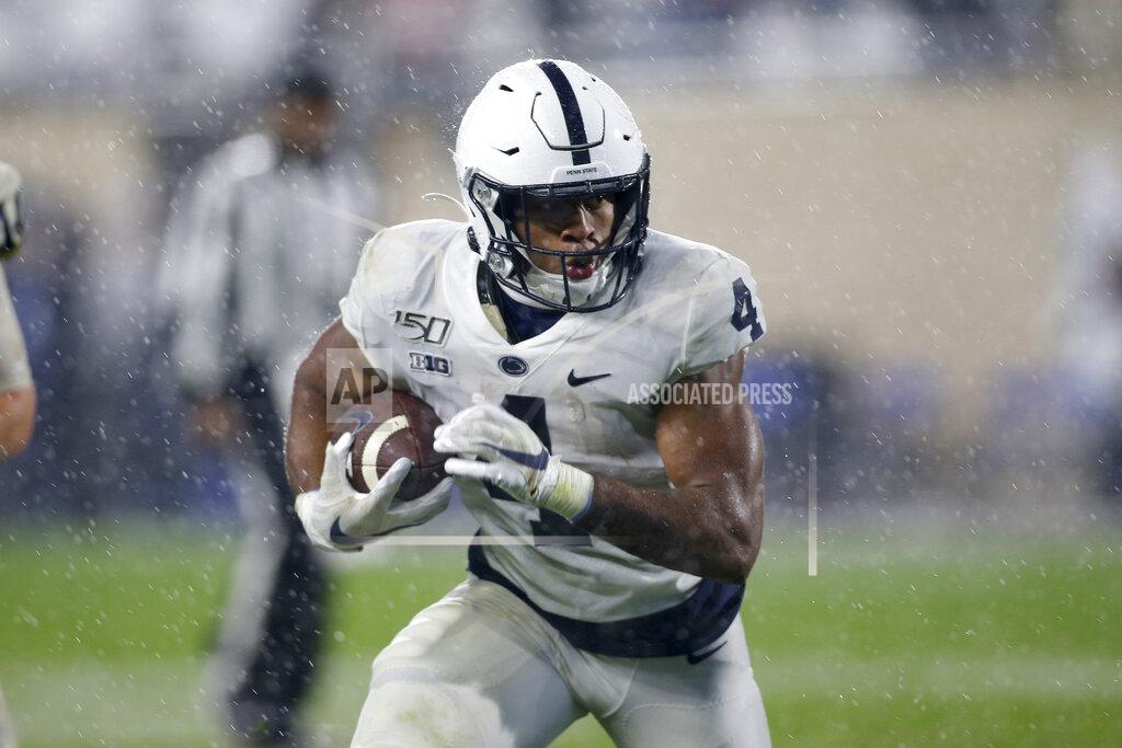 Al Goldis In the rain, Penn State's Journey Brown rushes against Michigan State during the fourth quarter of an NCAA college football game, Saturday, Oct. 26, 2019, in East Lansing, Mich. (AP Photo/Al Goldis)
