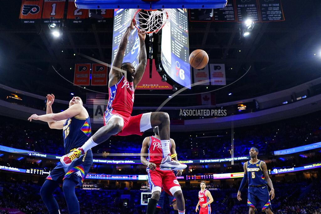 Matt Slocum Philadelphia 76ers' DeAndre Jordan, center, dunks the ball past Denver Nuggets' Nikola Jokic during the first half of an NBA basketball game, Monday, March 14, 2022, in Philadelphia. (AP Photo/Matt Slocum)