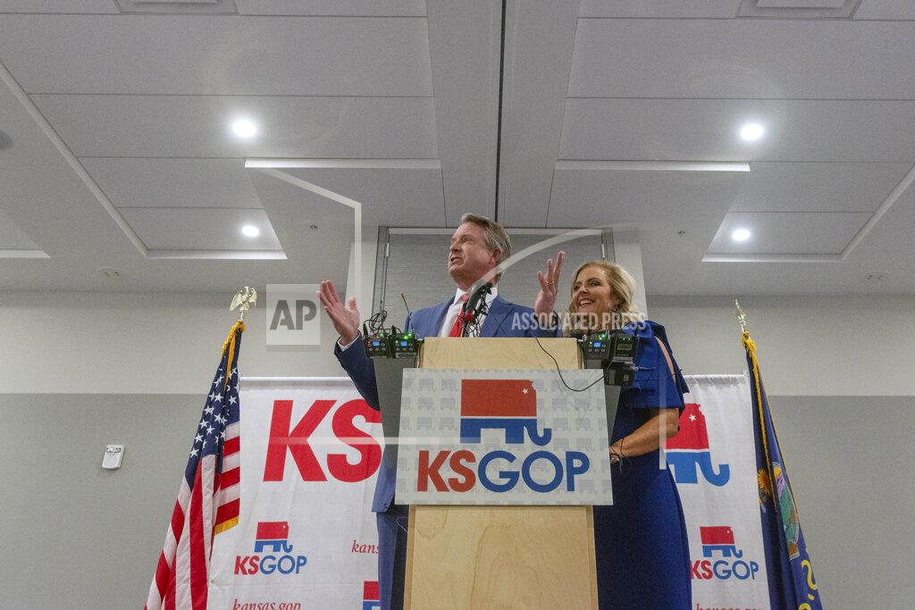 Evert Nelson Congressman Roger Marshall stands with his wife, Laina Marshall, to greet the crowd gathered at the Cyrus Hotel for a GOP watch party Tuesday evening, Nov. 3, 2020 in Topeka, Kan. Marshall is running against Barbara Bollier for the Kansas seat in the U.S. Senate. (Evert Nelson/The Topeka Capital-Journal via AP)