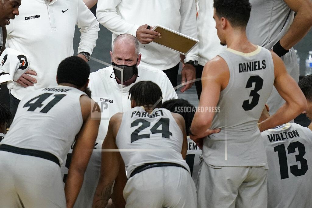 John Locher Colorado head coach Tad Boyle speaks with his players at at timeout during the second half of an NCAA college basketball game against California in the quarterfinal round of the Pac-12 men's tournament Thursday, March 11, 2021, in Las Vegas. (AP Photo/John Locher)
