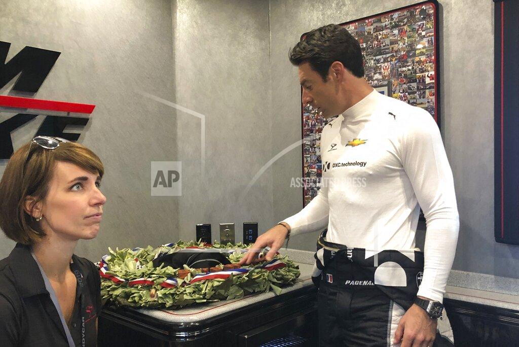 Larry Lage Indianapolis 500 champion Simon Pagenaud looks at the wreath he won less than a week ago and lamented seeing the leaves and orchids wilting, Friday, May 31, 2019 in Detroit. At the doubleheader in Detroit, the IndyCar points leaders is looking for a way to preserve his coveted prize and is energized to stay on top of the series. (AP Photo/Larry Lage)