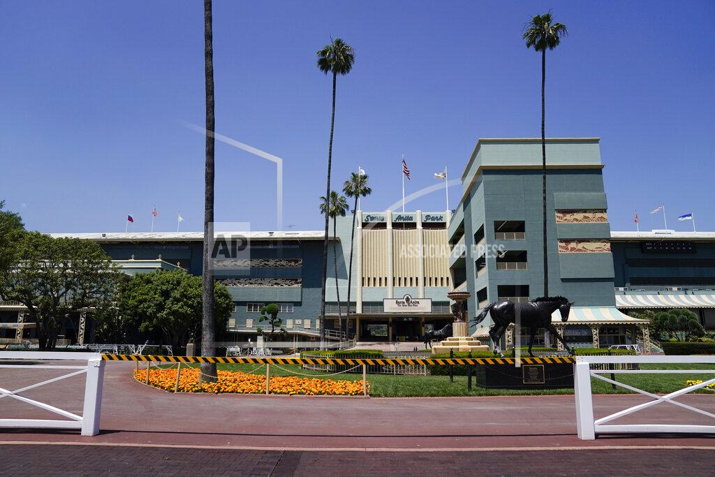 Ashley Landis In this Friday, May 22, 2020 photo, the grounds sit empty of fans during a day of horse racing at Santa Anita Park in Arcadia, Calif. Horse racing returned to the track after being idled for one and a half months because of public health officials' concerns about the coronavirus pandemic. (AP Photo/Ashley Landis)