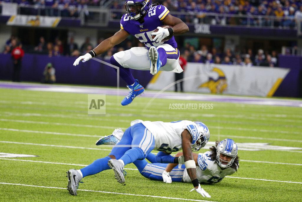 Bruce Kluckhohn Minnesota Vikings running back Alexander Mattison (25) leaps over Detroit Lions defenders Tavon Wilson and Jahlani Tavai, right, during the first half of an NFL football game, Sunday, Dec. 8, 2019, in Minneapolis. (AP Photo/Bruce Kluckhohn)