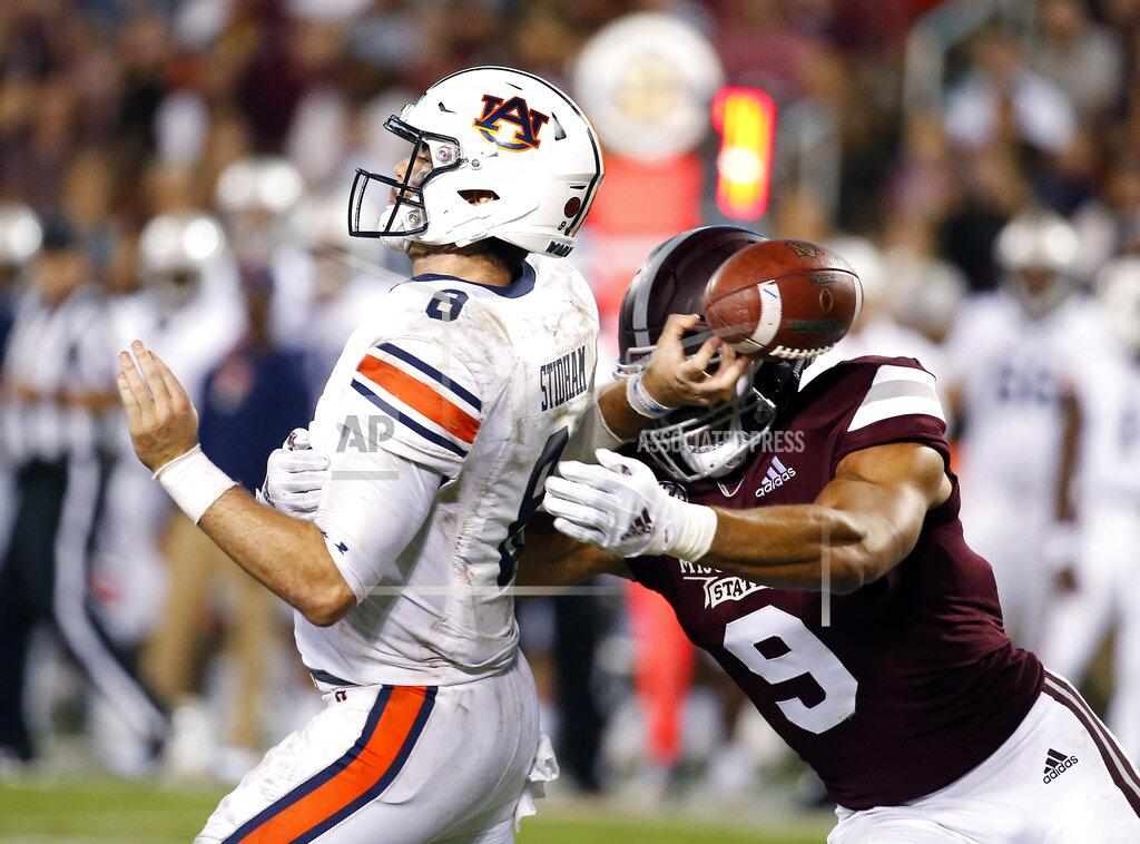 FILE - In this Oct. 6, 2018, file photo, Mississippi State defensive end Montez Sweat (9) forces Auburn quarterback Jarrett Stidham (8) to fumble as he attempts to pass during the second half of an NCAA college football game in Starkville, Miss. Sweat is a possible pick in the 2019 NFL Draft. (AP Photo/Rogelio V. Solis, File)