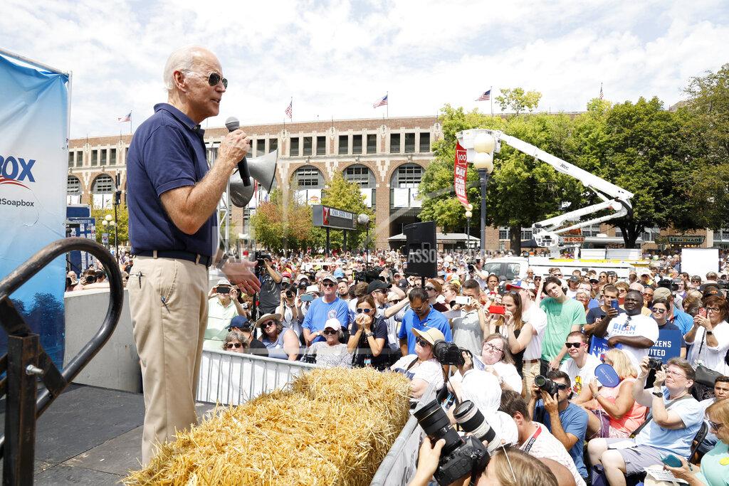 Charlie Neibergall FILE - In this Aug. 8, 2019 file photo, then Democratic presidential candidate former Vice President Joe Biden speaks at the Des Moines Register Soapbox during a visit to the Iowa State Fair in Des Moines, Iowa. With coronavirus cases rising throughout Iowa and around the nation, health experts are becoming increasingly worried about next month's Iowa State Fair, which will bring more than 1 million people to Des Moines. (AP Photo/Charlie Neibergall File)
