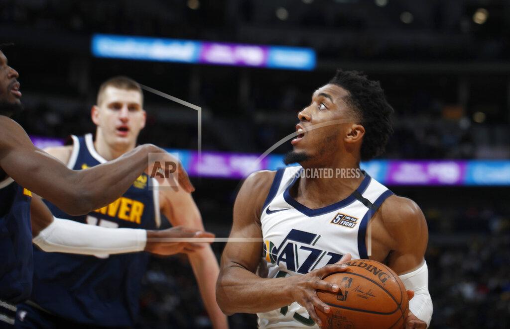 David Zalubowski FILE - In this Jan. 30, 2020, file photo, Utah Jazz guard Donovan Mitchell drives to the rim in the second half of an NBA basketball game against the Denver Nuggets in Denver. (AP Photo/David Zalubowski, File)