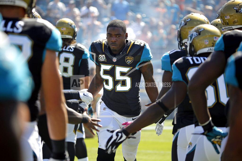 Stephen B. Morton FILE - Jacksonville Jaguars outside linebacker Geno Hayes (55) runs onto EverBank Field before the start of an NFL football game against the Cleveland Browns in Jacksonville, Fla., in this Sunday, Oct. 19, 2014, file photo. Hayes, a former NFL linebacker who starred at Florida State, has died. He was 33. The Tampa Bay Buccaneers on Tuesday, April 27, 2021, confirmed his death. He had liver disease and had been in hospice care. (AP Photo/Stephen B. Morton, File)