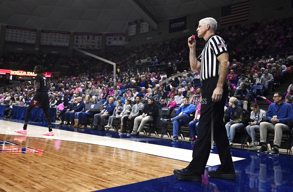 Jessica Hill Referee Bruce Morris officiates an NCAA college basketball game between Connecticut and Temple, Saturday, Feb. 9, 2019, in Storrs, Conn. Morris holds an NCAA record for the longest shot recorded.(AP Photo/Jessica Hill)