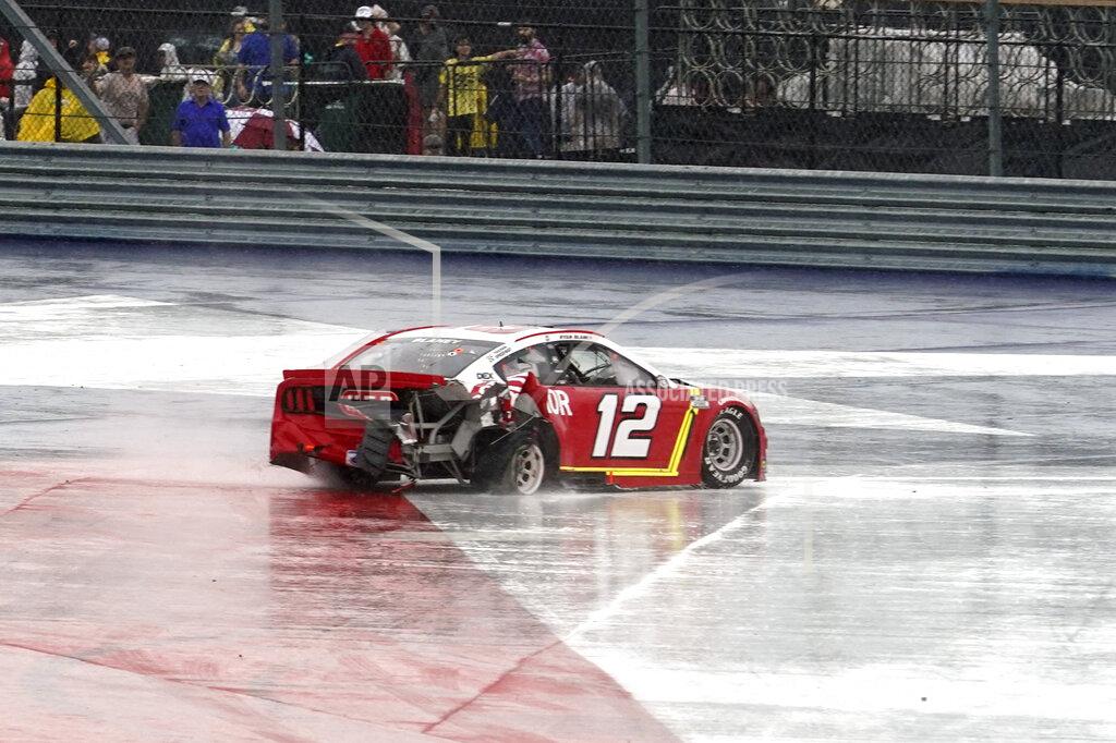 Chuck Burton Ryan Blaney (12) spins in Turn 12 during the NASCAR Cup Series auto race at the Circuit of the Americas in Austin, Texas, Sunday, May 23, 2021. (AP Photo/Chuck Burton)