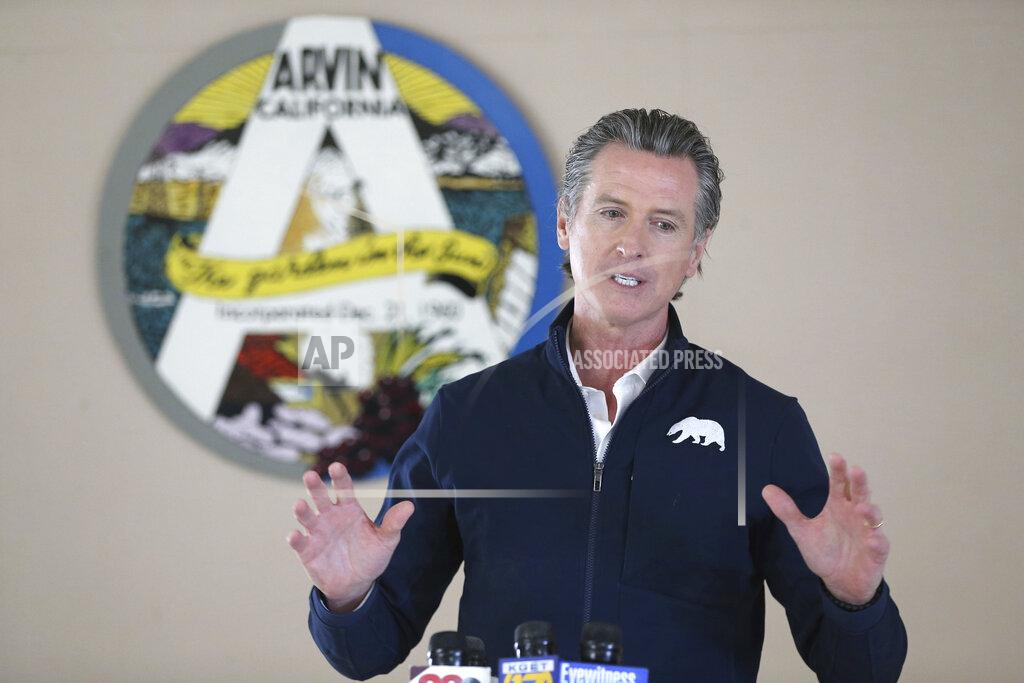 Alex Horvath Californian Governor Gavin Newsom talks during a visit to Arvin Veterans Hall in Arvin, Calif. in Kern County on Monday, Feb. 22, 2021, to highlight the state's efforts to administer COVID-19 vaccines quickly and equitably across California. Newsom said more vaccines are headed to California's vast Central Valley, an agricultural region that has been hard hit by the coronavirus. (Alex Horvath/Bakersfield Californian via AP)