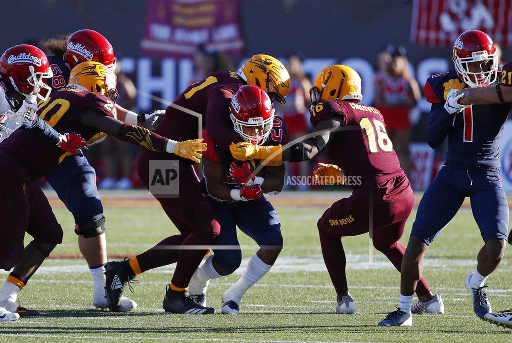 John Locher Fresno State running back Ronnie Rivers, center, runs for a gain against Arizona State during the second half of the Las Vegas Bowl NCAA college football game, Saturday, Dec. 15, 2018, in Las Vegas. (AP Photo/John Locher)
