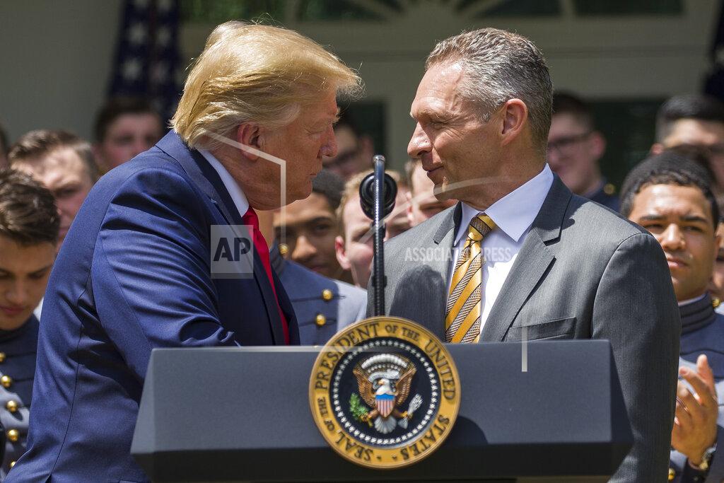 Alex Brandon President Donald Trump, left, shakes hands with Army head football coach Jeff Monken during the presentation of the Commander-in-Chief's Trophy to the U.S. Military Academy at West Point football team, in the Rose Garden of the White House, Monday, May 6, 2019, in Washington. (AP Photo/Alex Brandon)