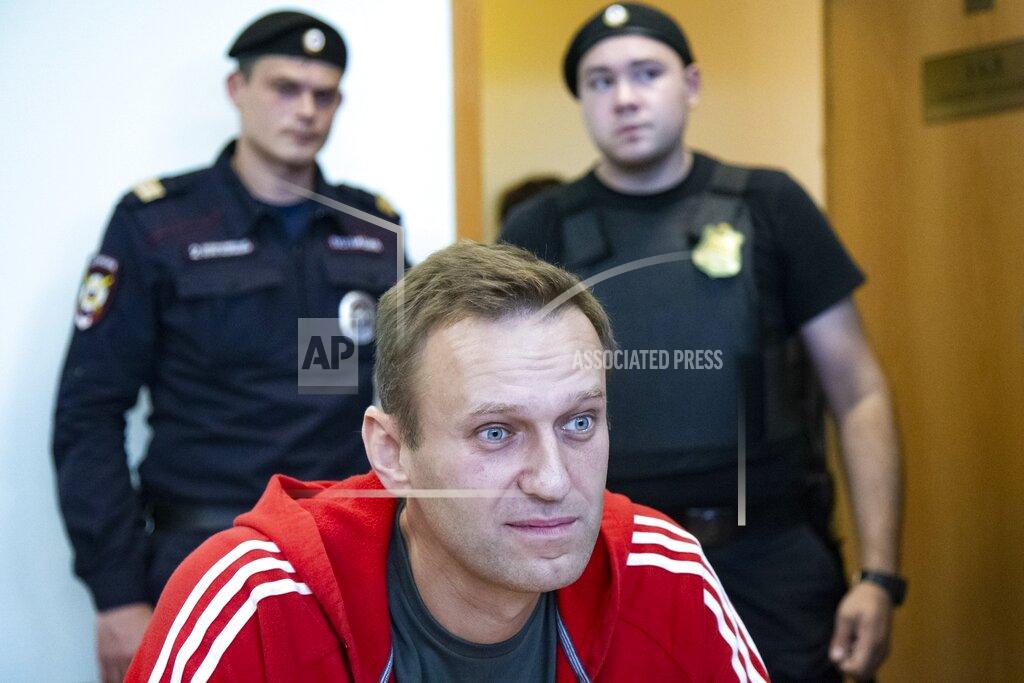 Alexander Zemlianichenko FILE - In this Aug. 22, 2019, file photo, Russian opposition leader Alexei Navalny speaks to the media prior to a court session in Moscow, Russia. The return of Navalny from Germany on Jan. 17, 2021, after he spent five months in Berlin recovering from a nerve agent poisoning was marked by chaos and popular outrage, and it ended, almost predictably with his arrest. (AP Photo/Alexander Zemlianichenko, File)