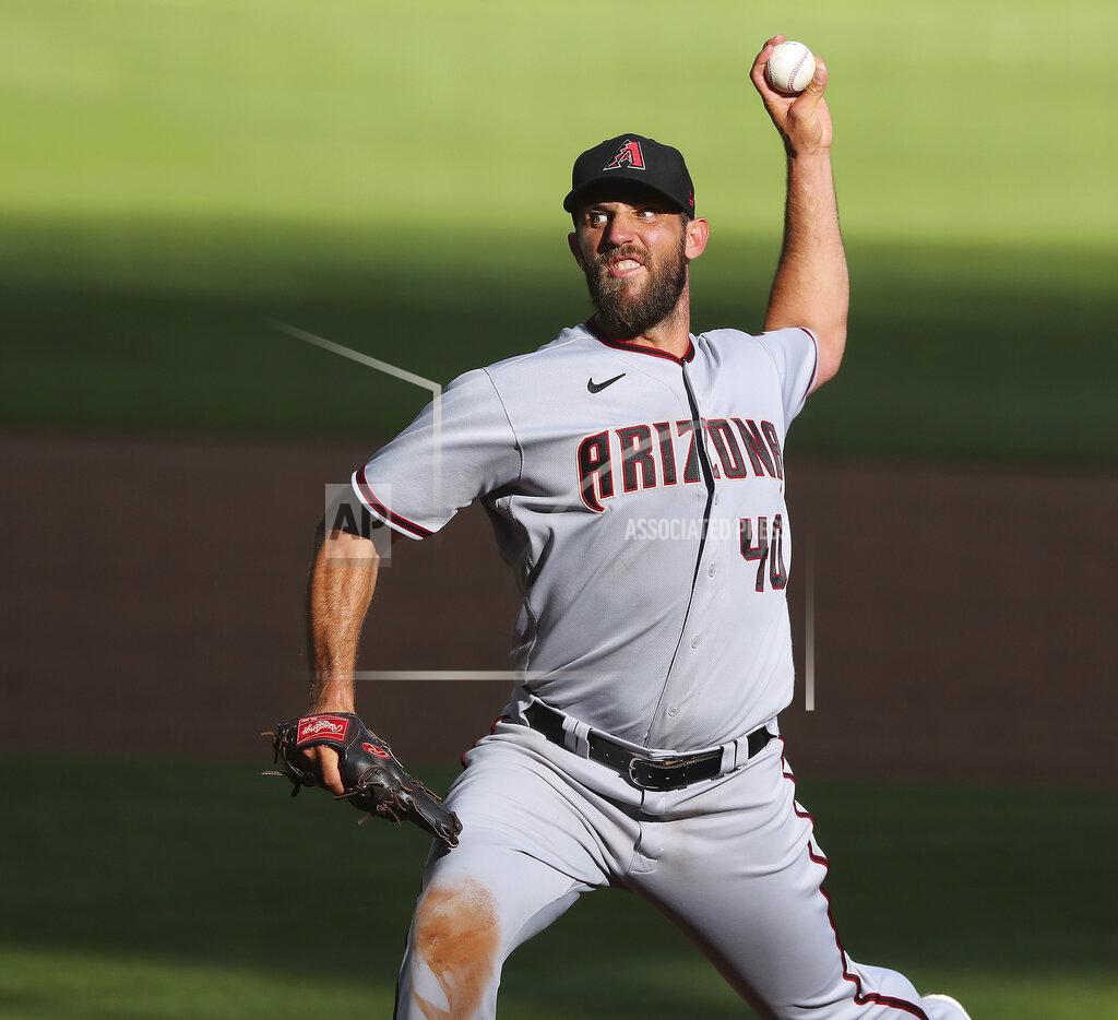 Curtis Compton Arizona Diamondbacks starting pitcher Madison Bumgarner delivers during the sixth inning of the second game of a double header against the Atlanta Braves Sunday, April 25, 2021, in Atlanta. (Curtis Compton/Atlanta Journal-Constitution via AP)