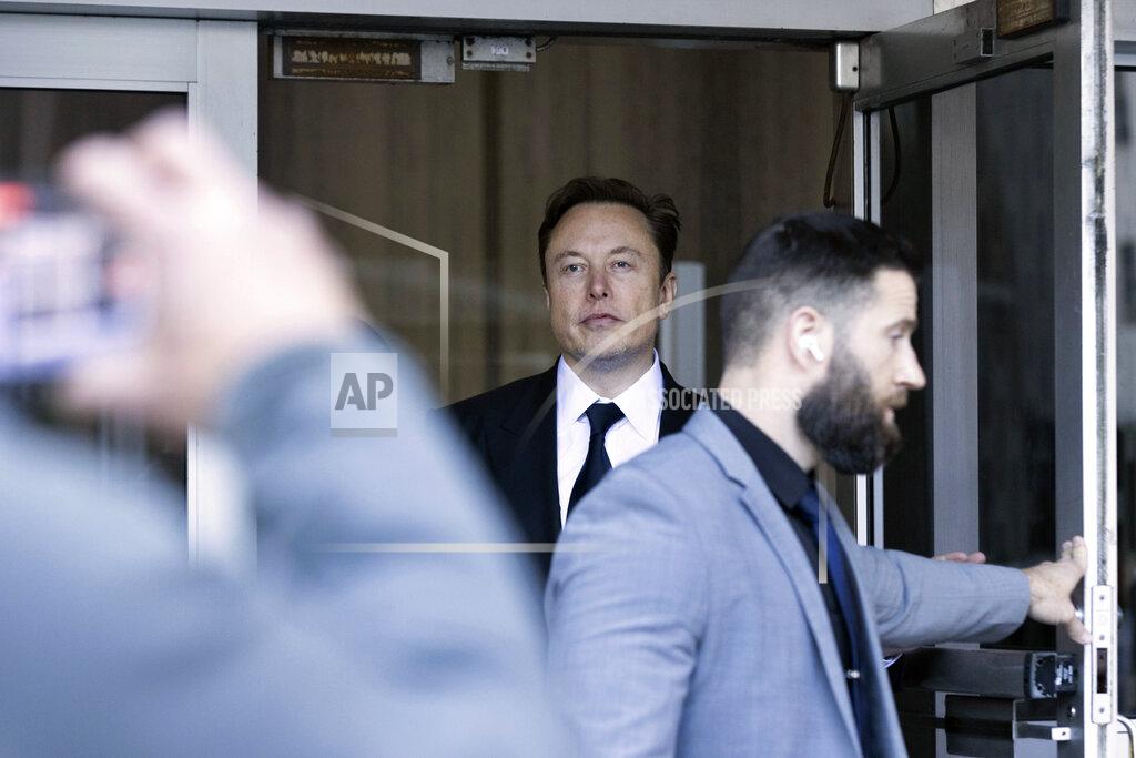 Benjamin Fanjoy Elon Musk leaves the Phillip Burton Federal Building and United States Court House in San Francisco, Tuesday, Jan. 24, 2023. Musk returned to federal court to defend himself against a class-action lawsuit that alleges he misled Tesla shareholders with a tweet about an aborted buyout that the billionaire defiantly insisted Tuesday he could have pulled off, had he wanted. (AP Photo/ Benjamin Fanjoy)