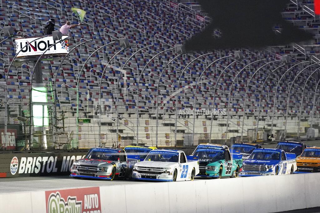 Steve Helber Grant Enfinger (98) and Brett Moffitt (23) lead the field at the start of the NASCAR Truck Series auto race Thursday Sept. 17, 2020, in Bristol, Tenn. (AP Photo/Steve Helber)