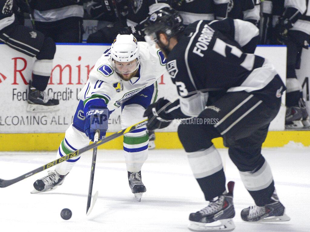 Mark Diorio FILE - In this June 13, 2015, file photo, Utica Comets' Nicklas Jensen, left, attempts to pass the puck as he is guarded by Manchester Monarchs' Derek Forbort during Game 5 of the Calder Cup American Hockey League series at Utica Memorial Auditorium in Utica, N.Y. Three American Hockey League teams have opted out of playing this season because of the ongoing COVID-19 pandemic. The Charlotte Checkers, Milwaukee Admirals and Springfield Thunderbirds opted out and will return in 2021-22, the AHL said. (Mark DiOrio/Observer-Dispatch via AP, File)