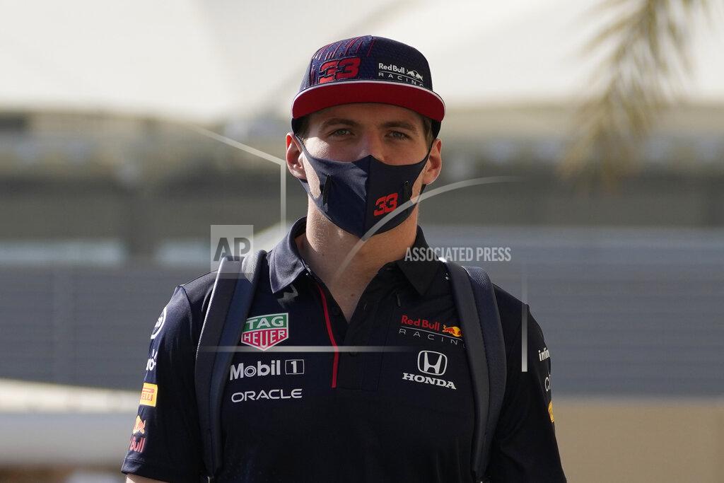 Hassan Ammar Red Bull driver Max Verstappen of the Netherlands arrives at the Yas Marina racetrack in Abu Dhabi, United Arab Emirates, Thursday, Dec. 9, 2021. (AP Photo/Hassan Ammar)