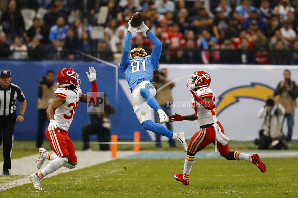 Eduardo Verdugo Los Angeles Chargers wide receiver Mike Williams, center, makes a catch as Kansas City Chiefs cornerback Charvarius Ward, left, and defensive back Rashad Fenton, right, defend, during the second half of an NFL football game Monday, Nov. 18, 2019, in Mexico City. (AP Photo/Eduardo Verdugo)